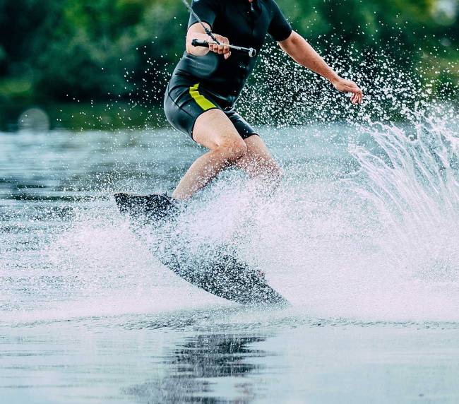 man jumping a wave on his wakeboard at Wakefest 2024