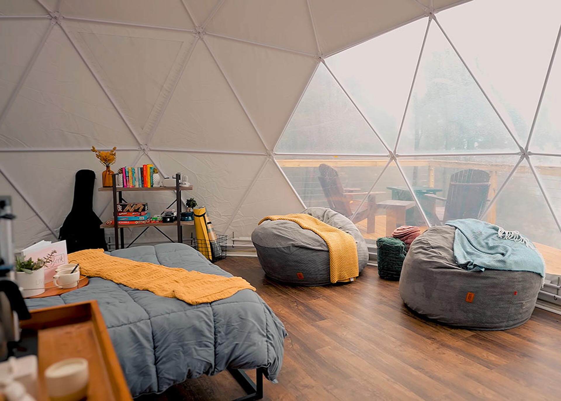 Interior of a glamping dome on a rainy day